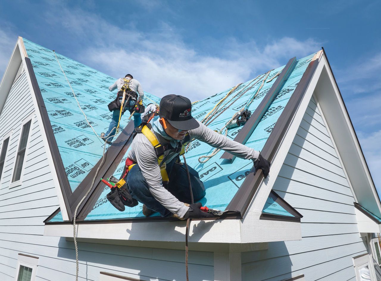 2f5f9005-820a-49dc-b902-24c15d4d158d Roofer installs GAF StormGuard on the roof of a home.