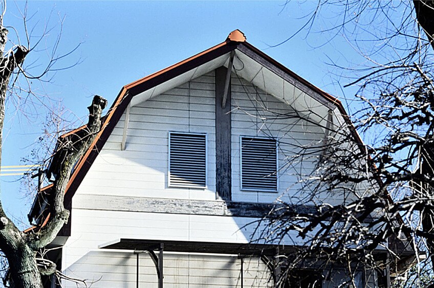 A gambrel roof on a sunny day.