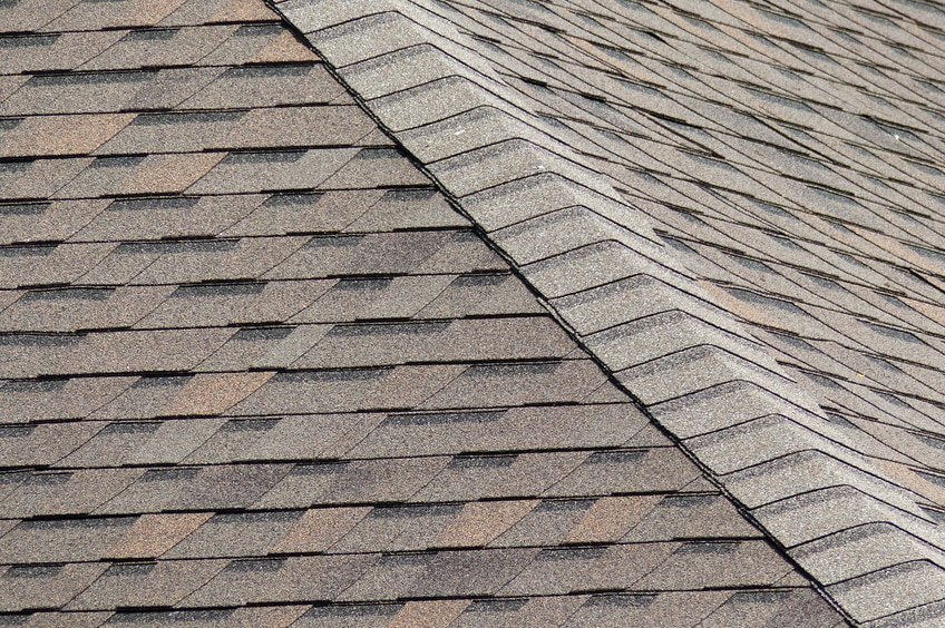 A composition roof using asphalt shingles