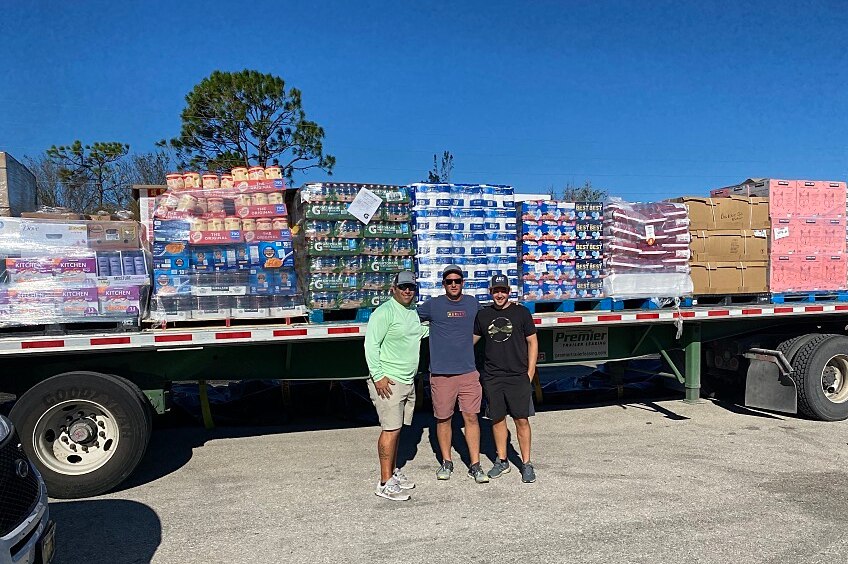 GAF Team in front of roofing materials to support community members impacted by hurricane Ian.