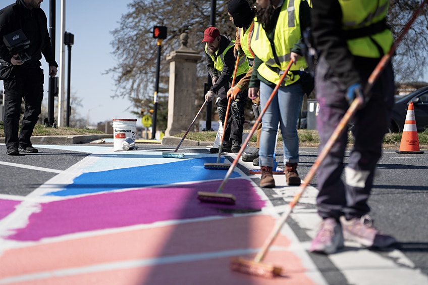 GAF StreetBond® coating is applied to a street in Paicoma, Los Angeles; GAF Cool Community project