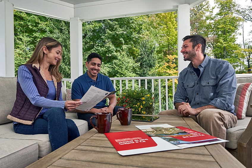 Couple consulting with a representative on home insurance.