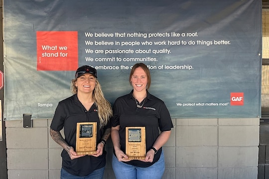 GAF Sustainability Award winners holding their award.