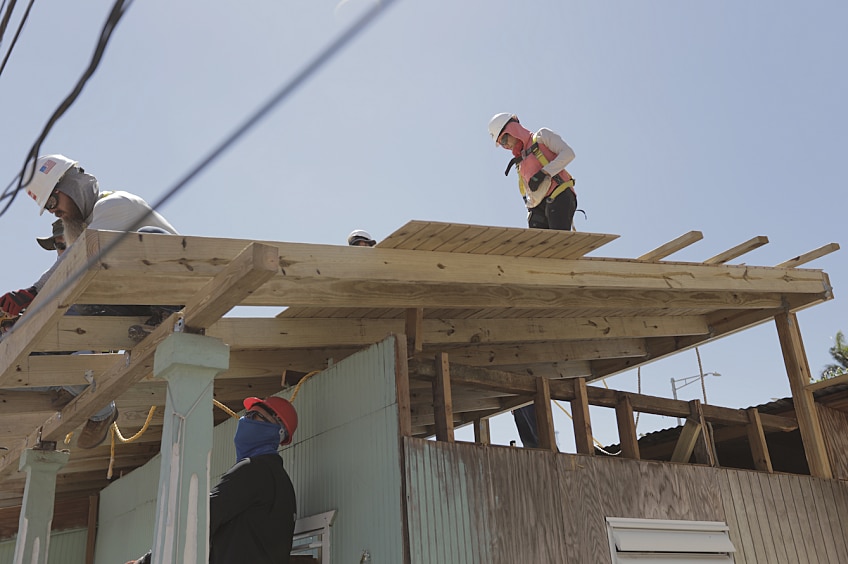 GAF Community Matters team members repair a storm-damaged roof on a home in Puerto Rico