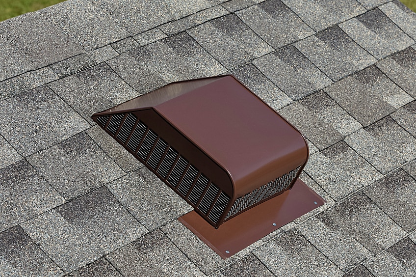 Image of a brown MasterFlow product installed on a grey roof.
