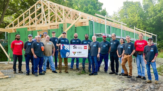 GAF Burgaw VIBE Group in front of a Habitat for Humanity build