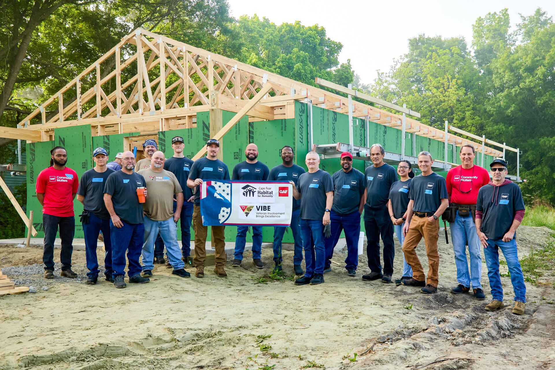 GAF Burgaw VIBE Group in front of a Habitat for Humanity build