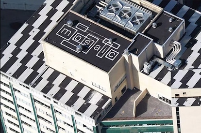 An aeiral view of a roof on a commercial building that used GAF asphaltic roofing system materials.