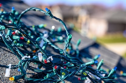 Tangled pile of Christmas lights on roof 