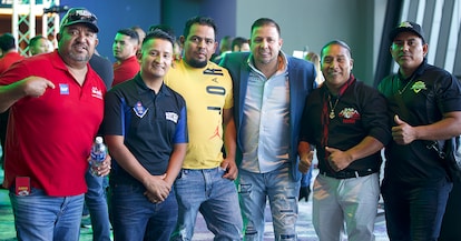 Luis Velasquez poses with a group of men at a GAF event.