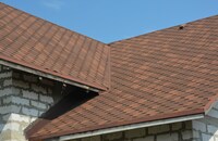 A brown asphalt roof with roof valley.