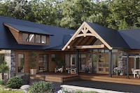 GAF TimberSteel™ Metal Roof shingles in obsidian black color on a log cabin home.