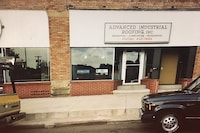 A commercial roofing contractor stapling roof.
