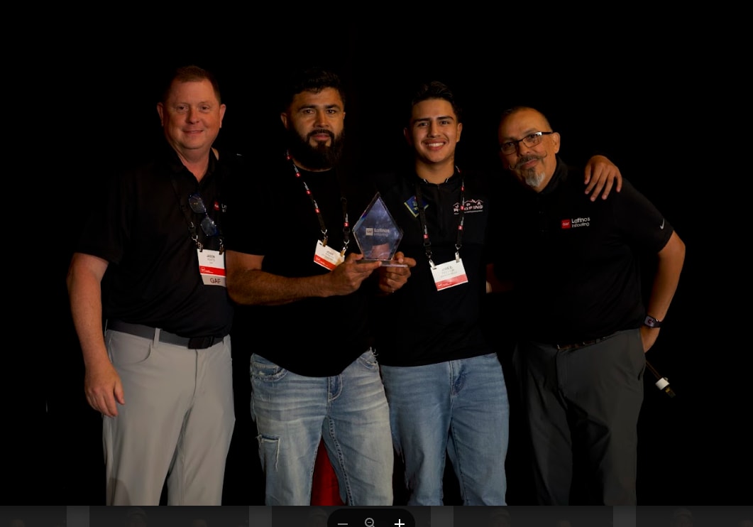 men at gaf expo atlanta Presenters holding an award at GAF Expo Atlanta