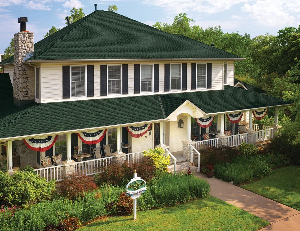 GAF Hunter Green Shingles installed on a hip roof