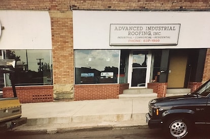 A commercial roofing contractor stapling roof.