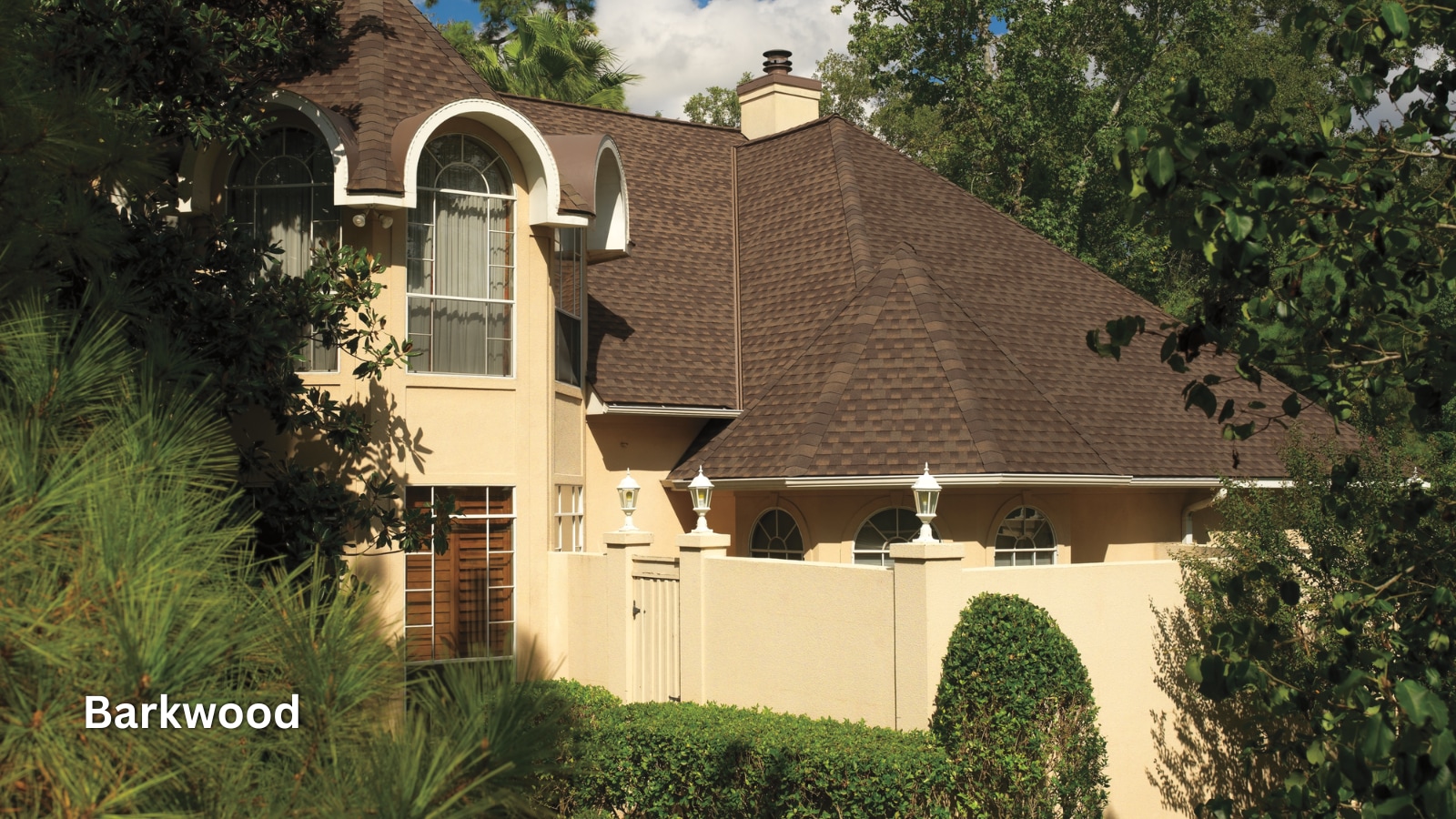 a4dc6a47-0500-435d-b49d-4acb3933ff13 GAF Timberline HD shingles in the color Barkwood on the roof of a home.