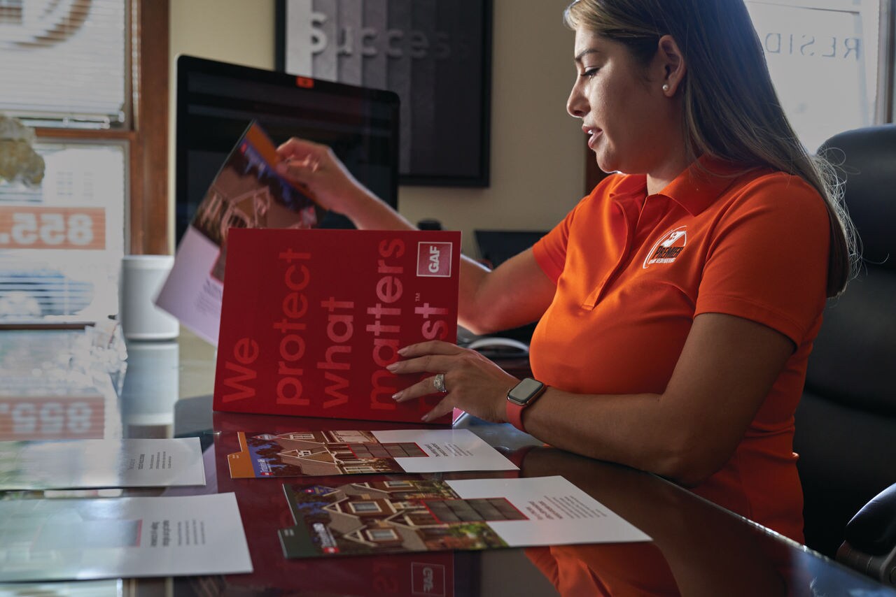 Roofing Professional Reviewing Educational Materials from GAF