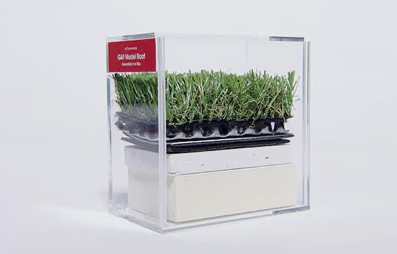 d2a2416d-fec3-4afc-b2b8-c2850491151f Hands-on roof assembly model made from real and simulated layers in an acrylic box.