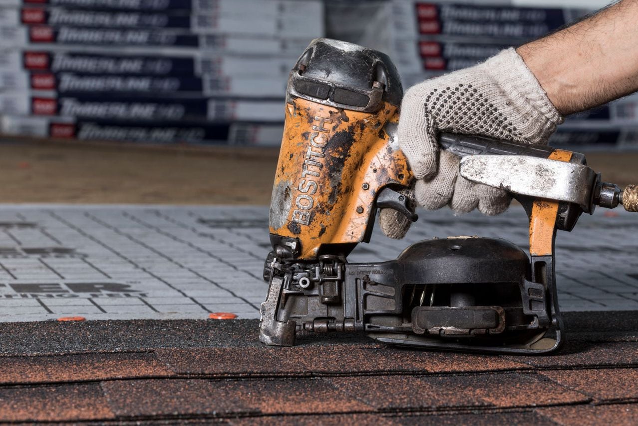 095bb042-66ce-43dd-830e-9e89ed3e6064 A nail gun with air compressor is essential for installing a roof