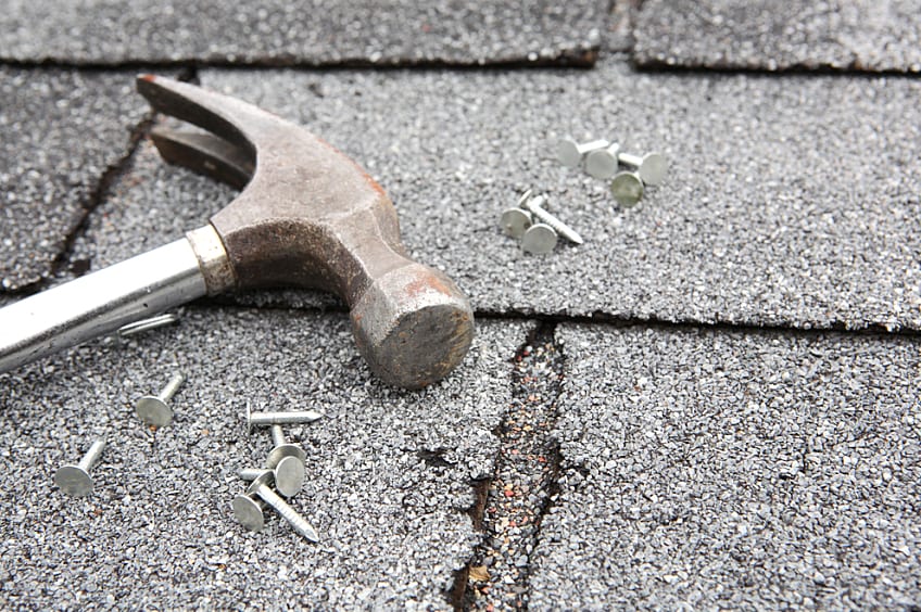 A contractor working on a roof