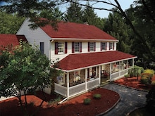 GAF's Timberline HDZ Patriot Red shingles on a two story white home.