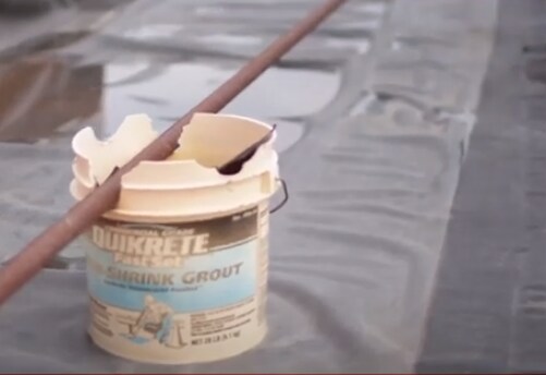 plastic bucket modified to support a pipe Plastic bucket modified to support a pipe