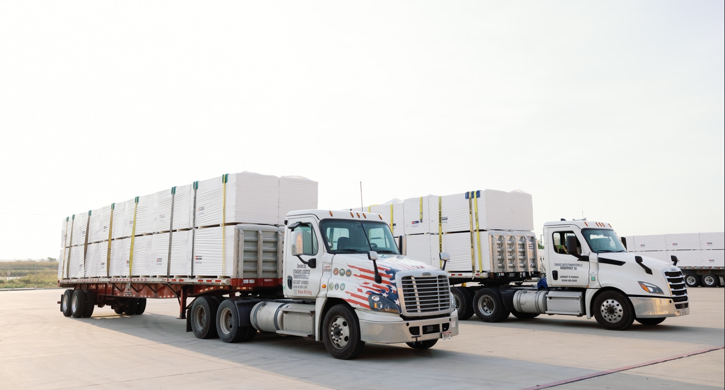 Standard Logistics Trucks delivering material from Gainesville