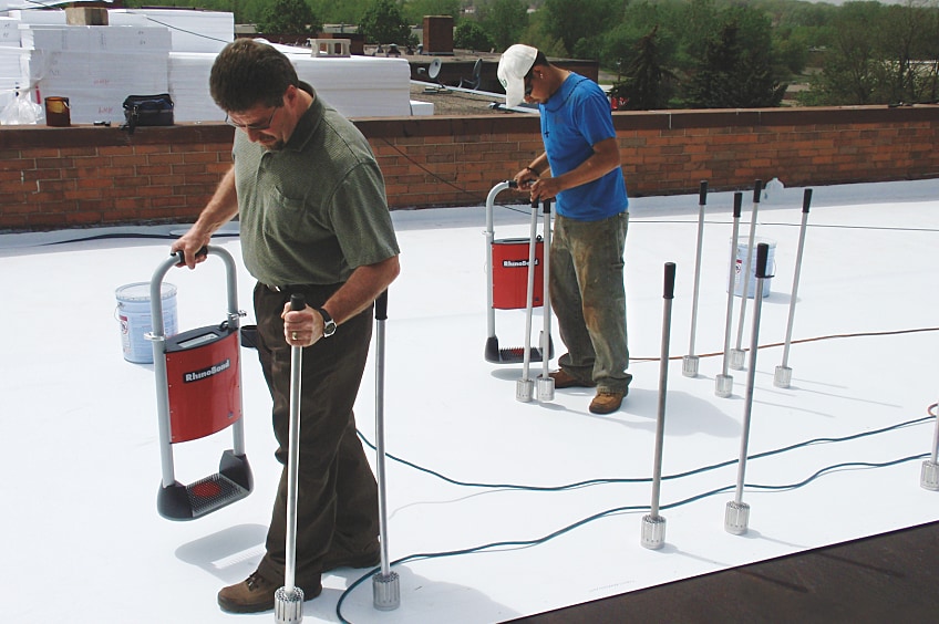 Rhinobond being applied to a low-slope roof