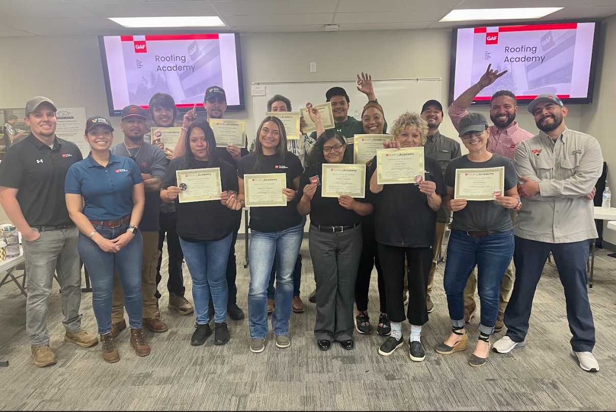 denver women in roofing course Roofing Academy Graduates standing with their teachers