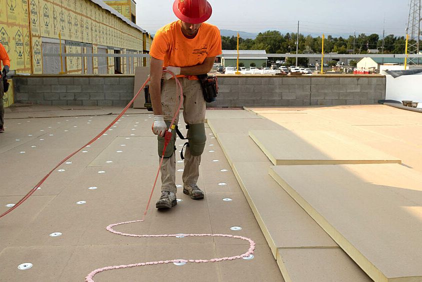 Roofer installs GAF accessories designed for utilizing the 179D solar tax credit